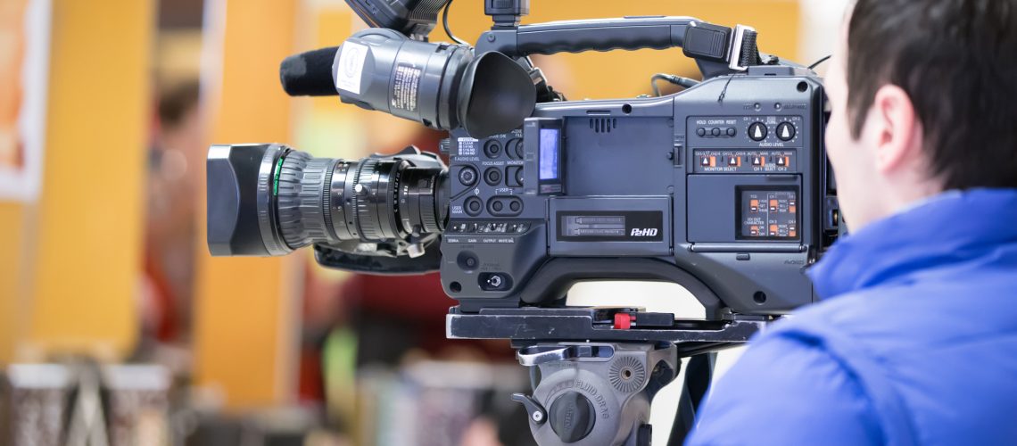 Male cameraman in a television studio. Video Operator